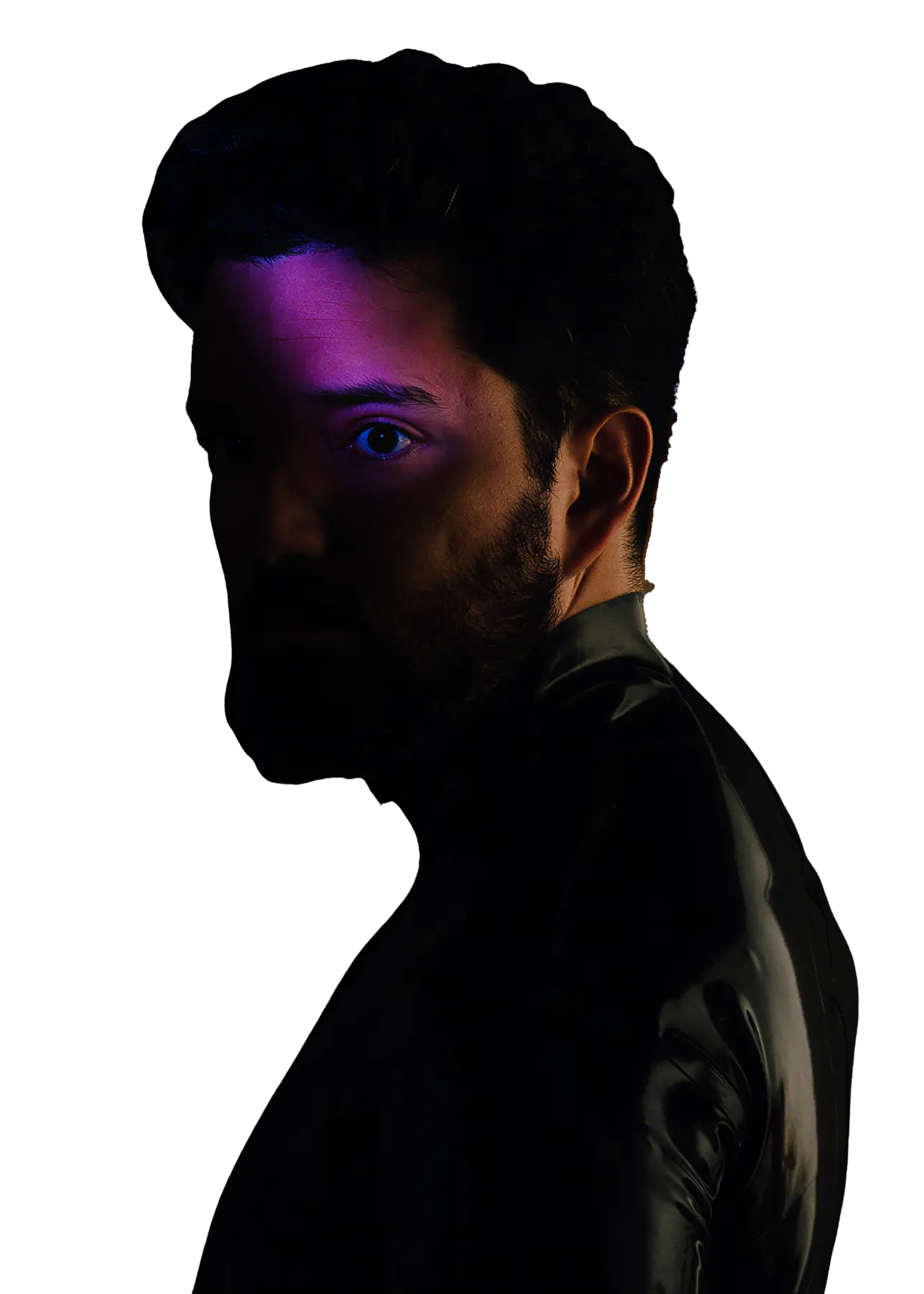 Stephen Widom looking over his shoulder, half his face lit in violet.